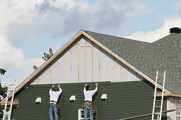 Professional Siding Repair technician working in Tilghman, MD